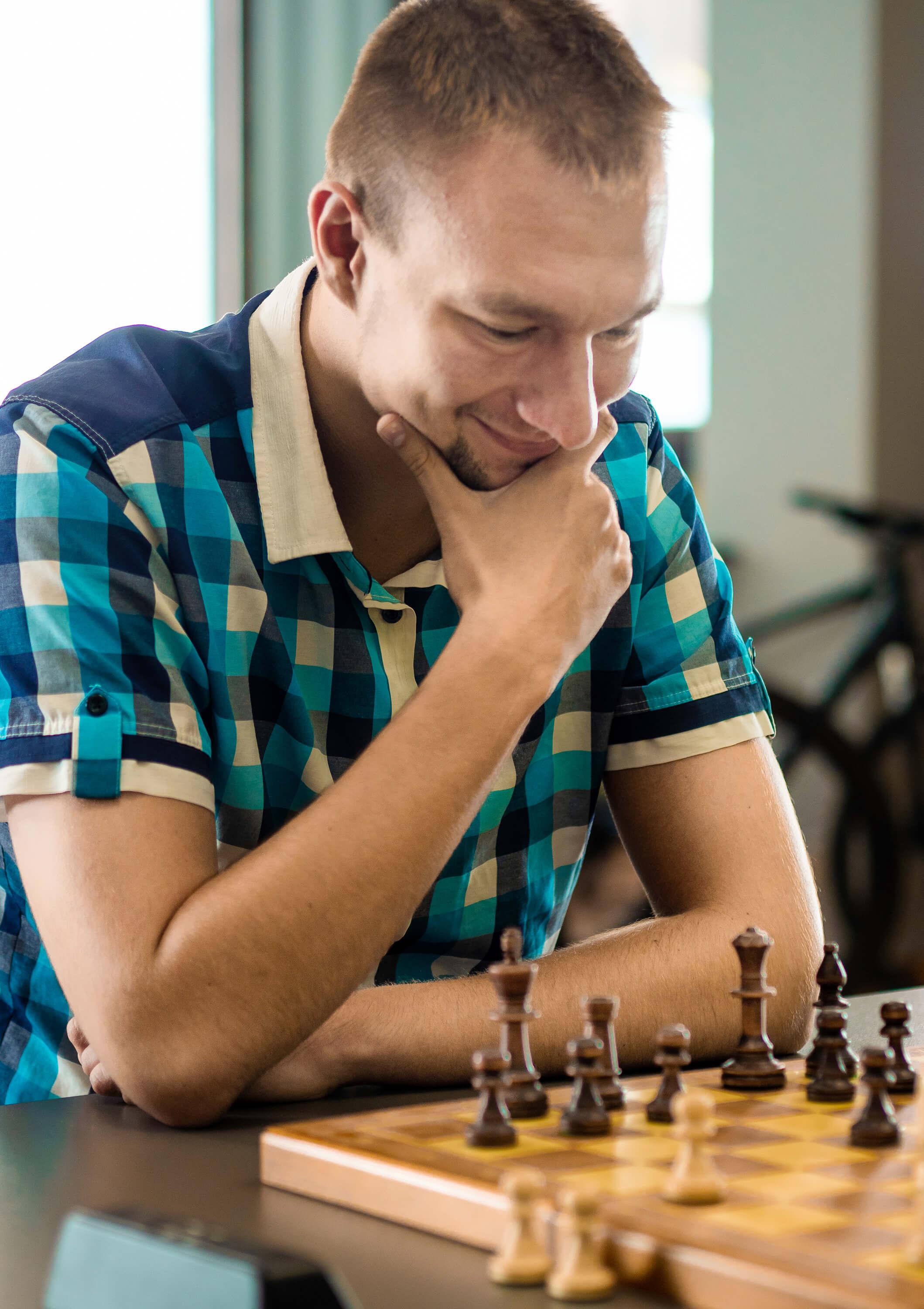 A photo of a man playing chess